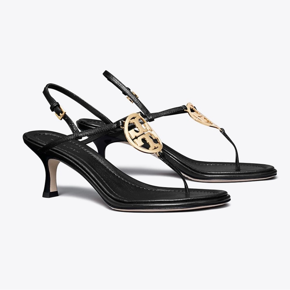 Never worn Tory Burch black thong sandals with gold emblem size 7.5.